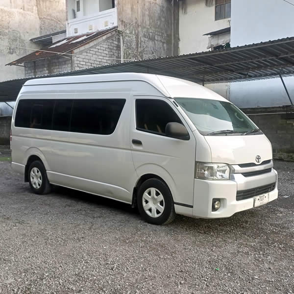 Side view Toyota Hiace 14 seater passenger van for Ngurah Rai International Airport (DPS) Denpasar, Bali Airport Transfer to Juanda Airport (SUB) Surabaya, East Java, Car and Van Charter