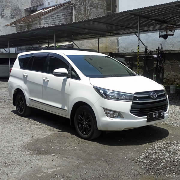 Side view Toyota Innova 6-seater passenger car for Ngurah Rai (DPS) Denpasar Bali Airport Transfer and Car and Van Charter to Balangan